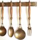 Brass and wood kitchen utensils with wall display, 60s