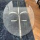 Oval glass coffee table with chrome legs, vintage 70s design.