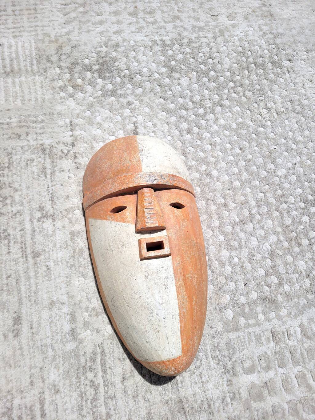 Wooden mask in the spirit of Adouma