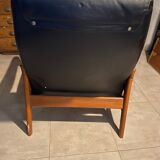 Scandinavian armchair and footrest in teak and leather 1960