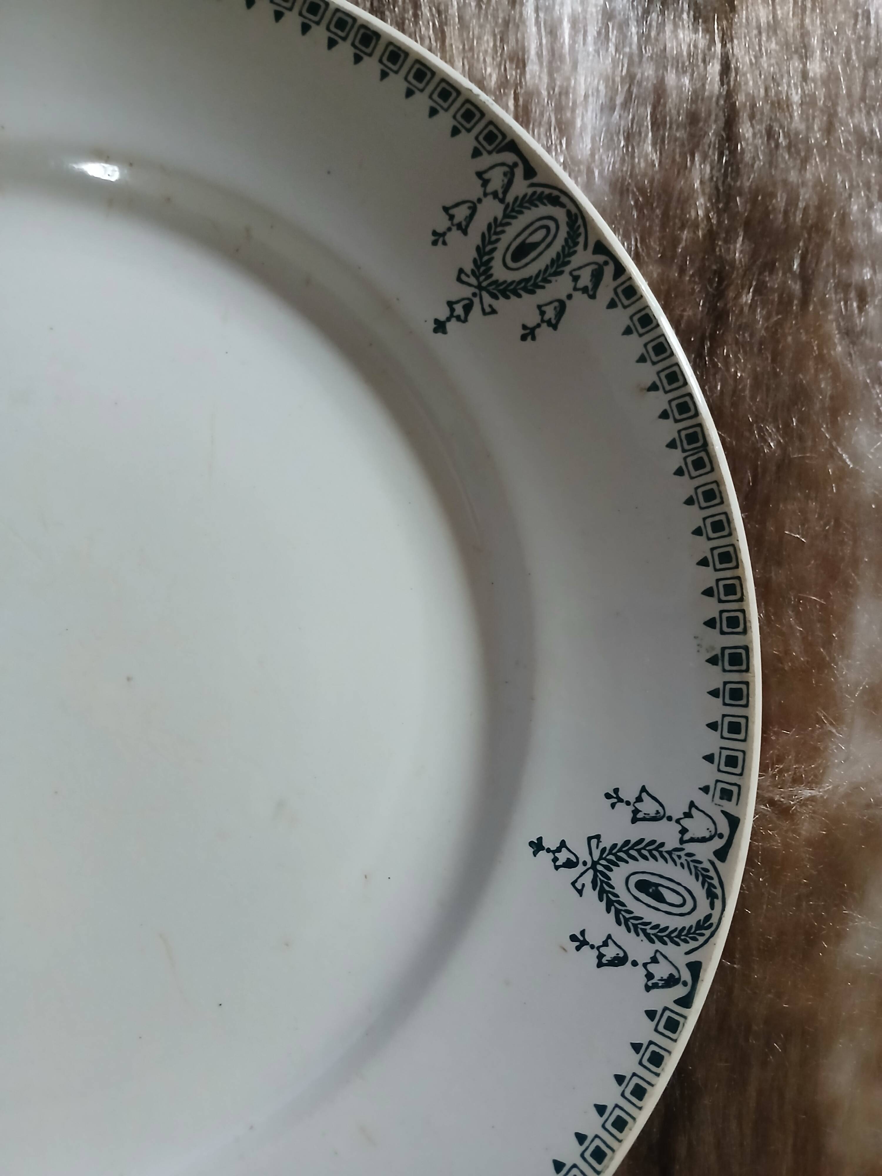 Old round plate made of ironstone