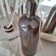 Bouteille en grès marron foncé vintage