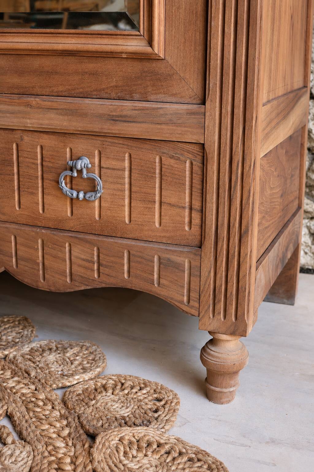 Antique walnut bonnetière with bevelled mirror.