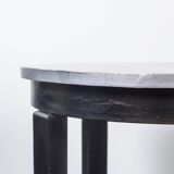 Round Art Deco black painted wooden side table with lower shelf, 1930s.