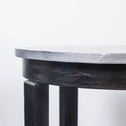 Round Art Deco black painted wooden side table with lower shelf, 1930s.