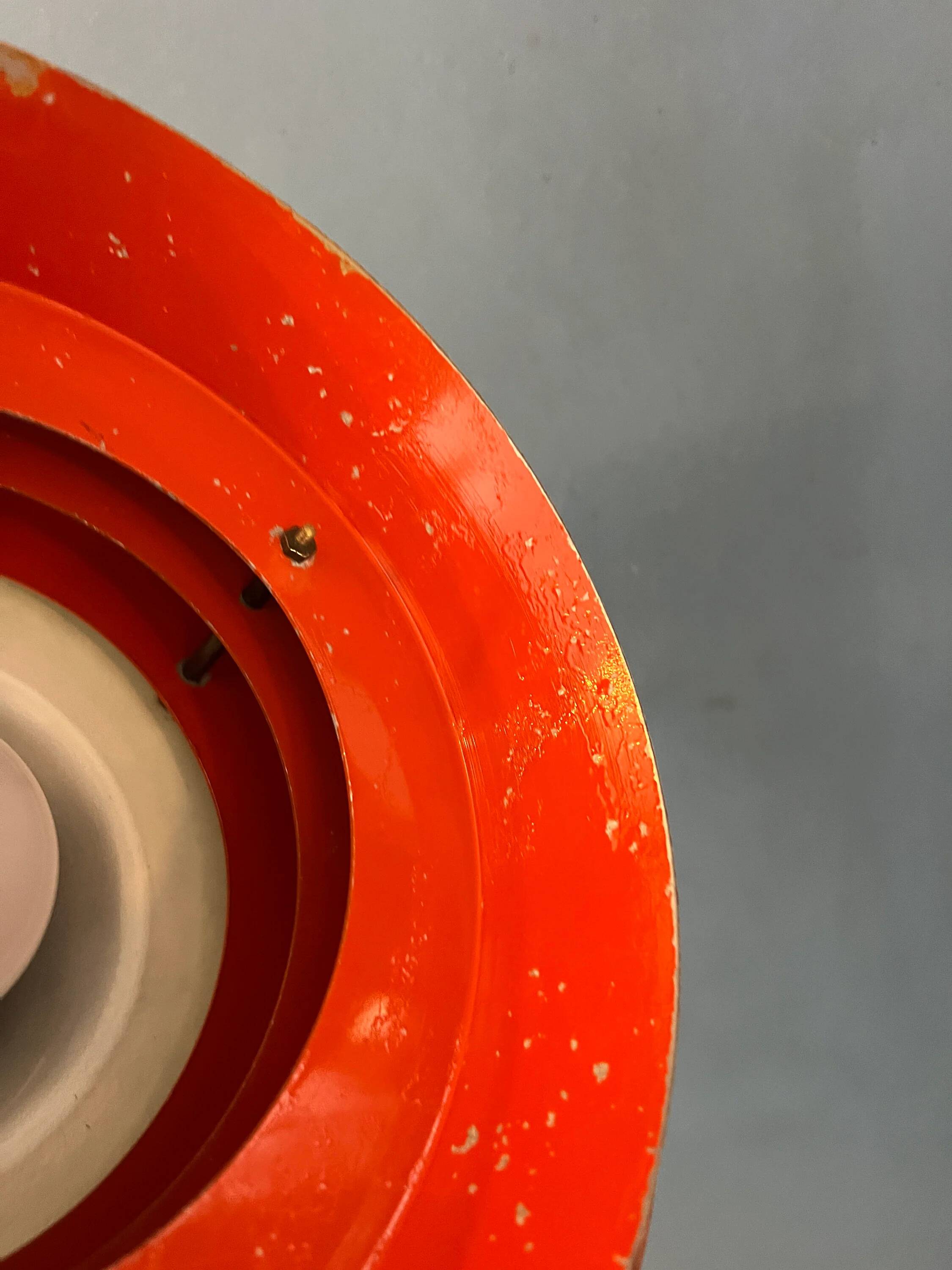 Mid-century Danish style orange brass suspension light.