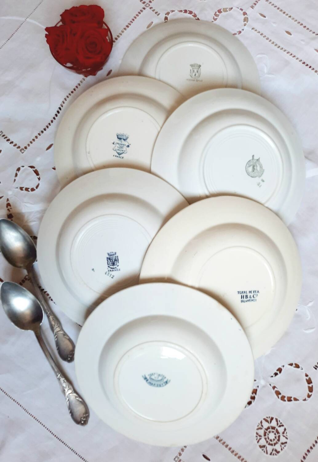 Old mismatched hollow plates in iron earth earthenware accompanied by a soup tureen