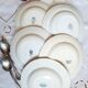 Old mismatched hollow plates in iron earth earthenware accompanied by a soup tureen