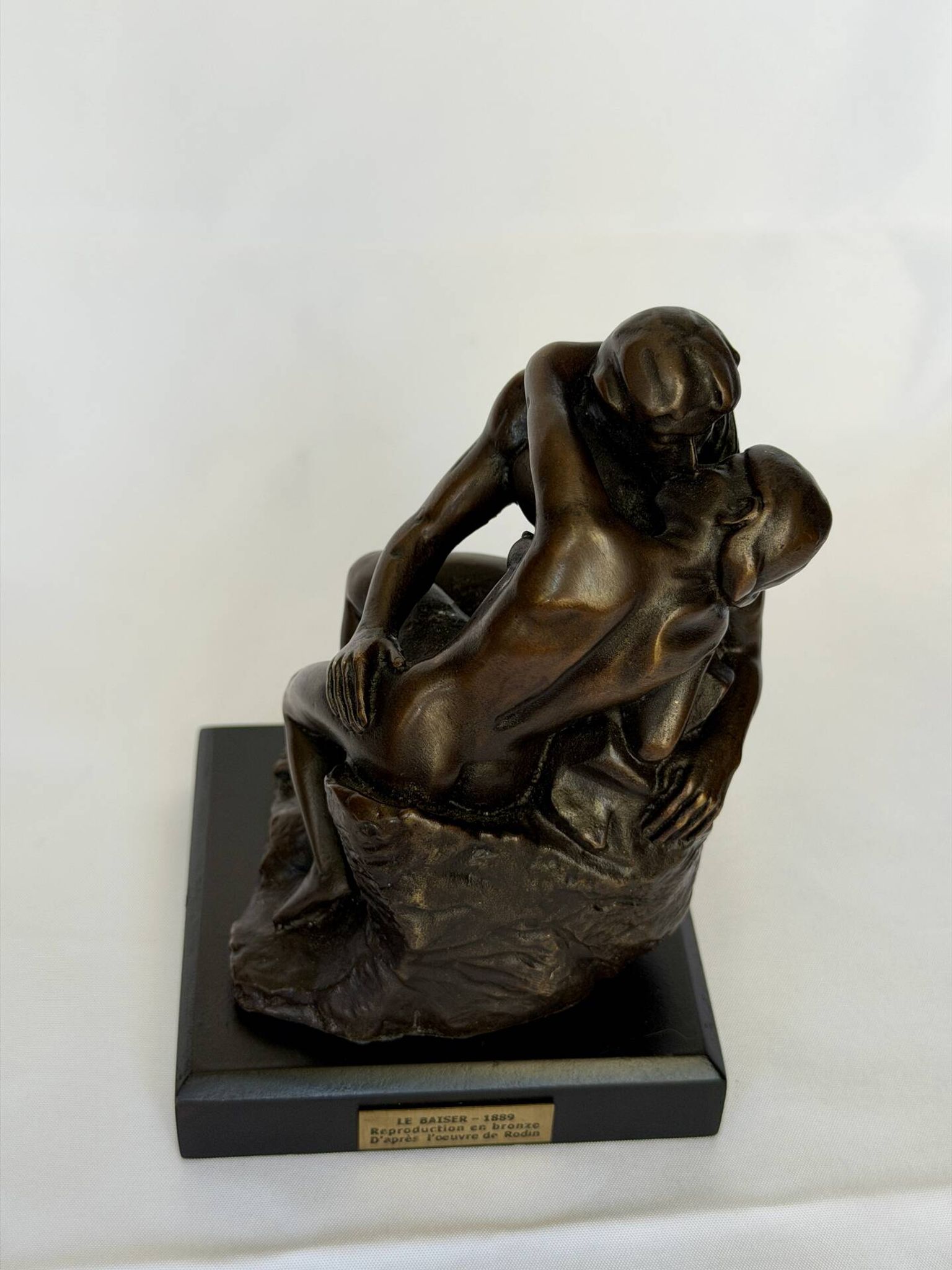 The bronze sculpture The Kiss, a reproduction of Rodin's statue, French sculpture.