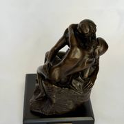 The bronze sculpture The Kiss, a reproduction of Rodin's statue, French sculpture.