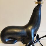 Lampe otarie noire irisée bleue en terre cuite