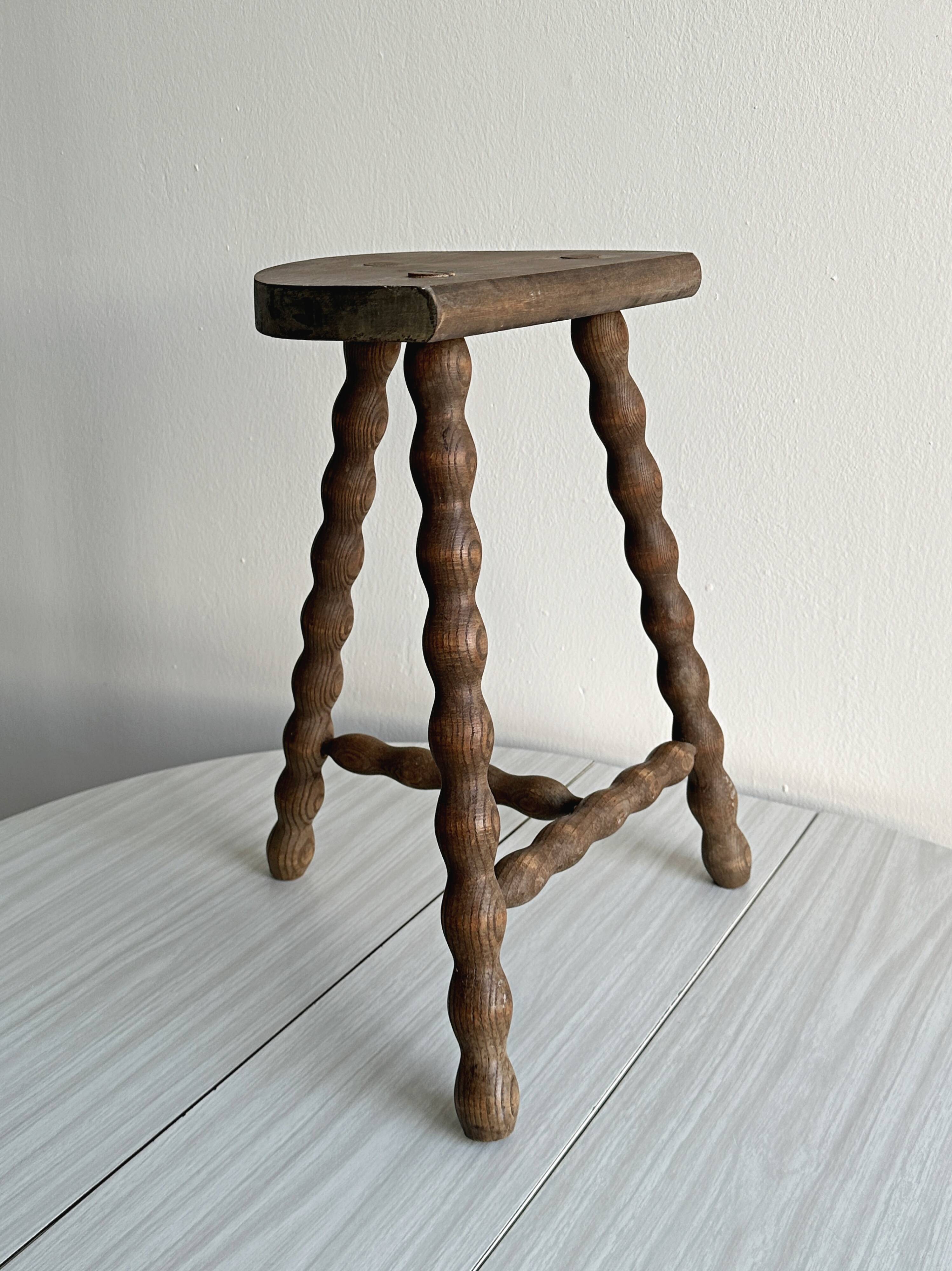 Tripod stool with turned wooden legs