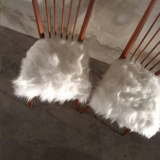 Pair of vintage Scandinavian Hygge chairs in solid wood and synthetic Mongolian sheepskin seat
