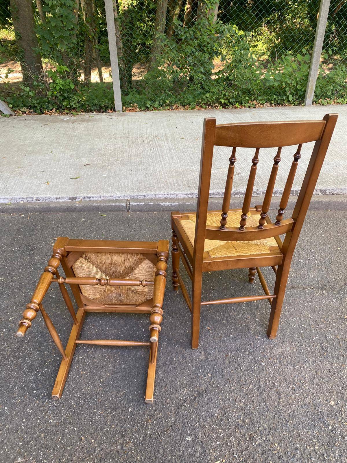 Solid wood chair with a straw seat and carved bar backrest.