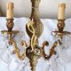 pair of bronze wall lights with pendants