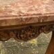 Carved wooden coffee table with shell pattern and removable pink marble top, old