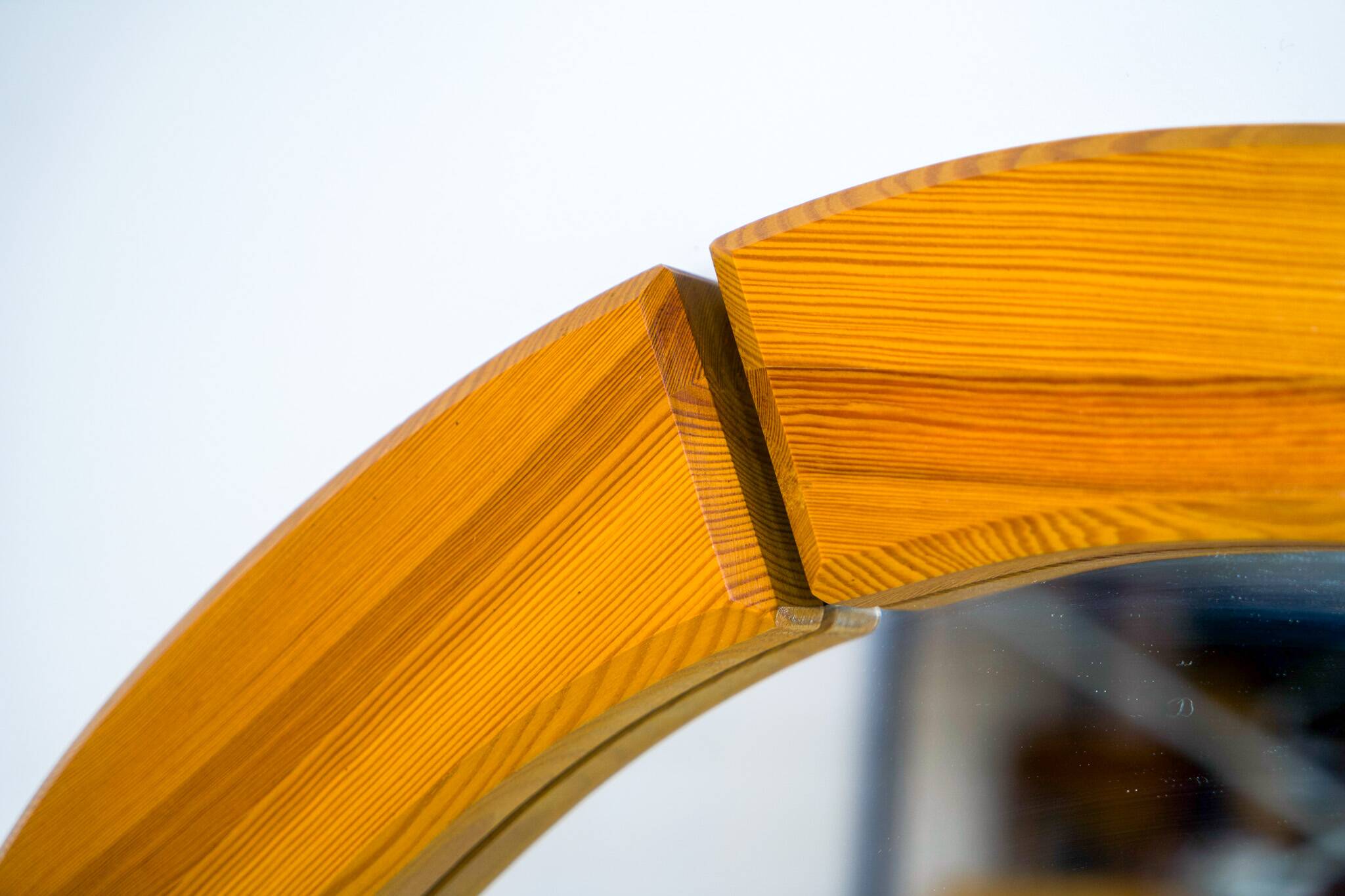 Sculptural wall-mirror in solid pine