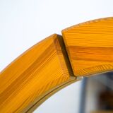 Sculptural wall-mirror in solid pine