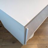 A vintage mid century space age sideboard with white sliding doors