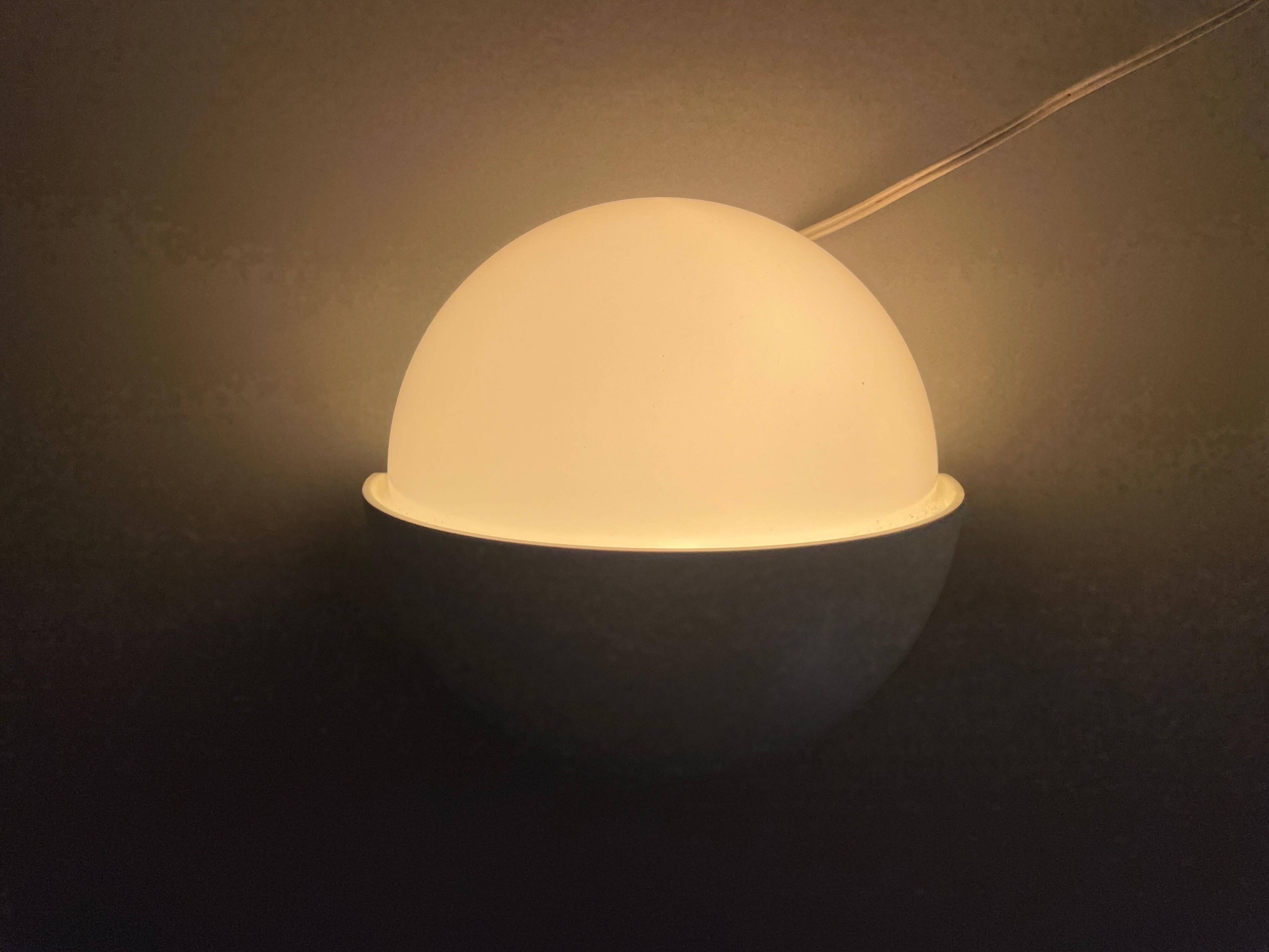 Round wall lights, small and large, in white metal by Bega, 1970s, Germany.