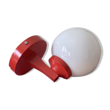 Red plastic wall light with a white opaline glass globe.