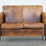 Charming 2-seater designer sofa made of sheep leather with a rustic look