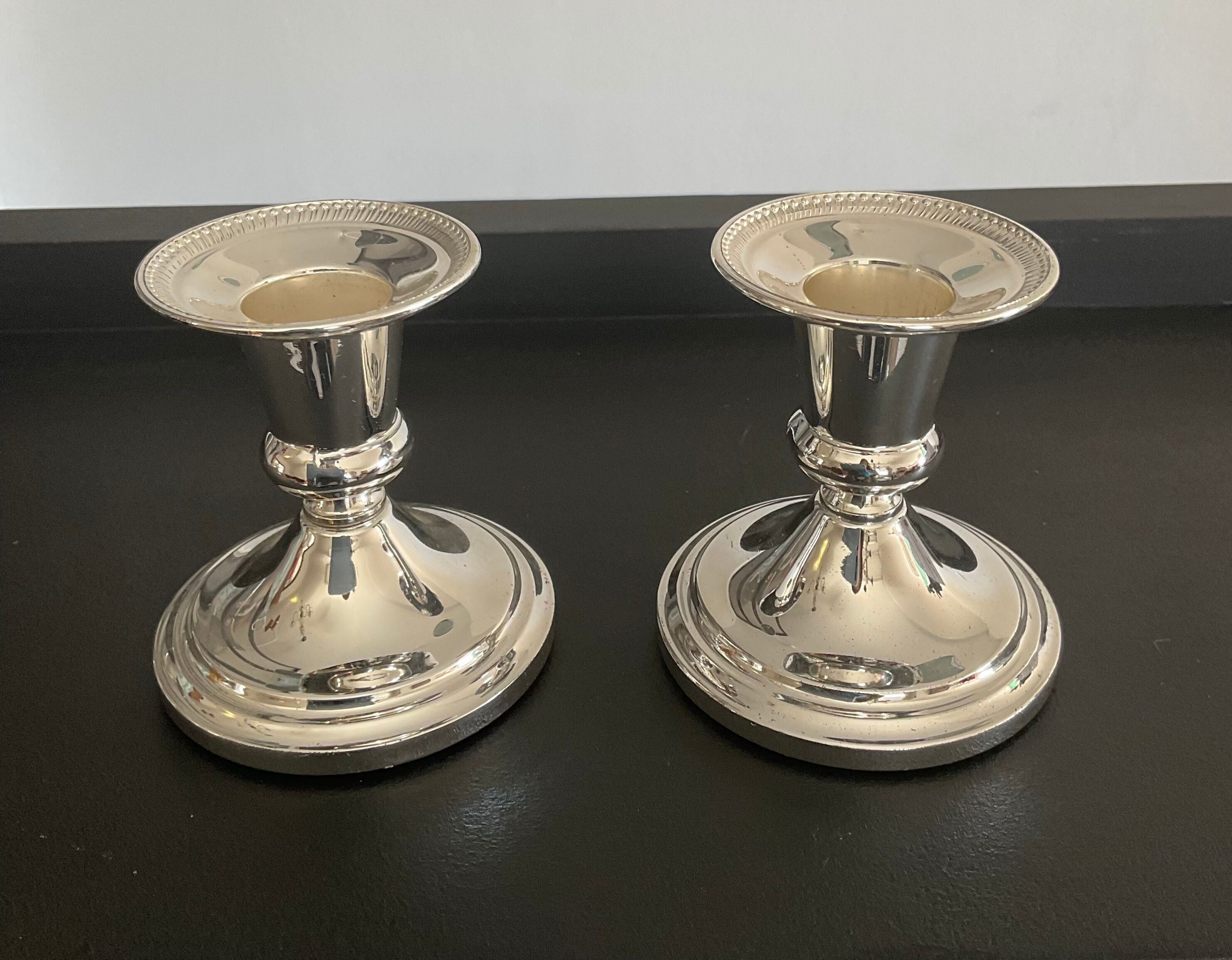 Pair of vintage candle holders in silver metal