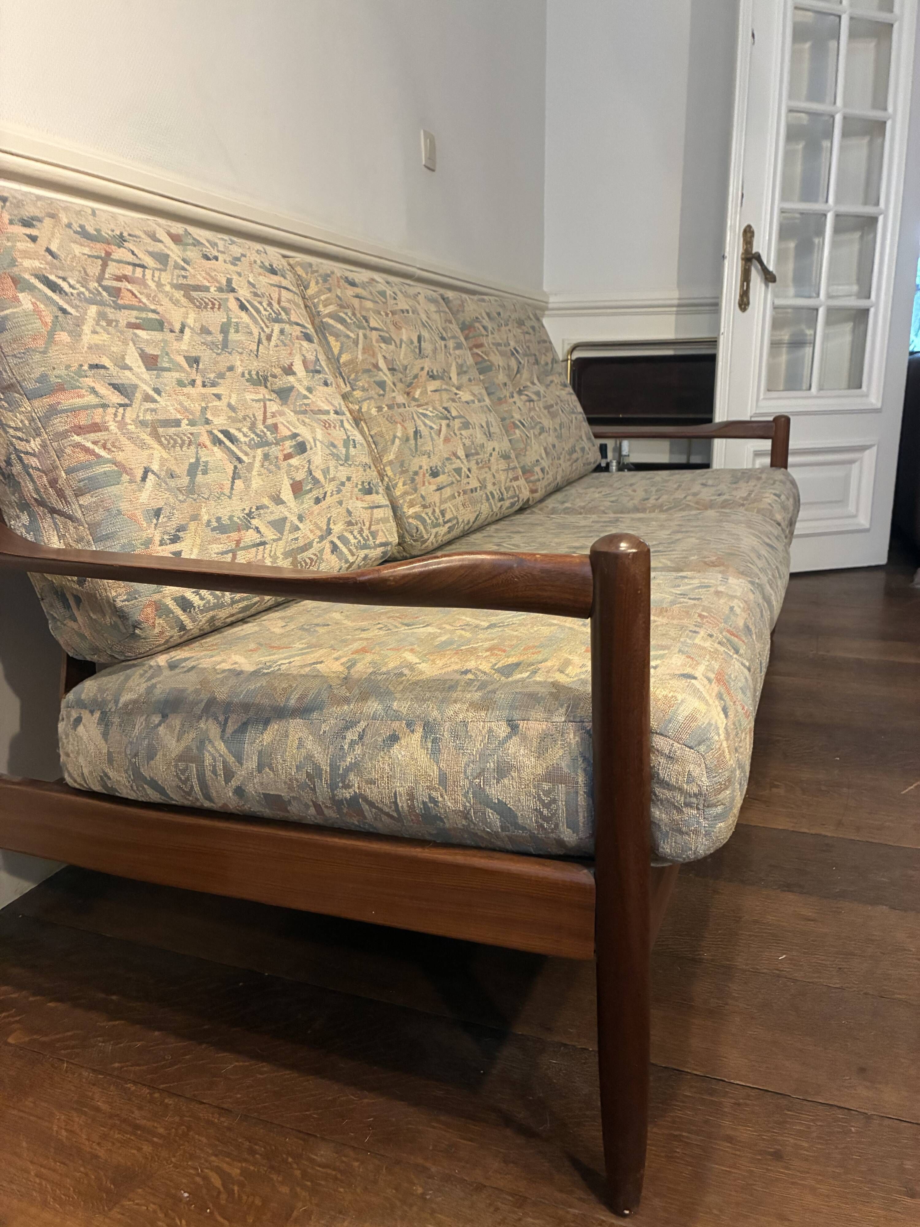 Vintage three-seater sofa — wood and sculptural backrest