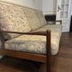 Vintage three-seater sofa — wood and sculptural backrest