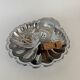 Large silver-plated serving dish in the shape of a vintage shell.