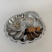 Large silver-plated serving dish in the shape of a vintage shell.