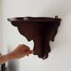 Pair of antique carved wooden shelves