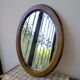 Oval wooden mirror