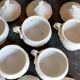 Set of seven covered pots and tray old white slurry nineteenth