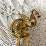 Swan toilet paper dispenser in brass