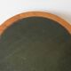 Empire style gueridon in solid wood and green leather.
