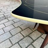 Coffee table in black glass and wood