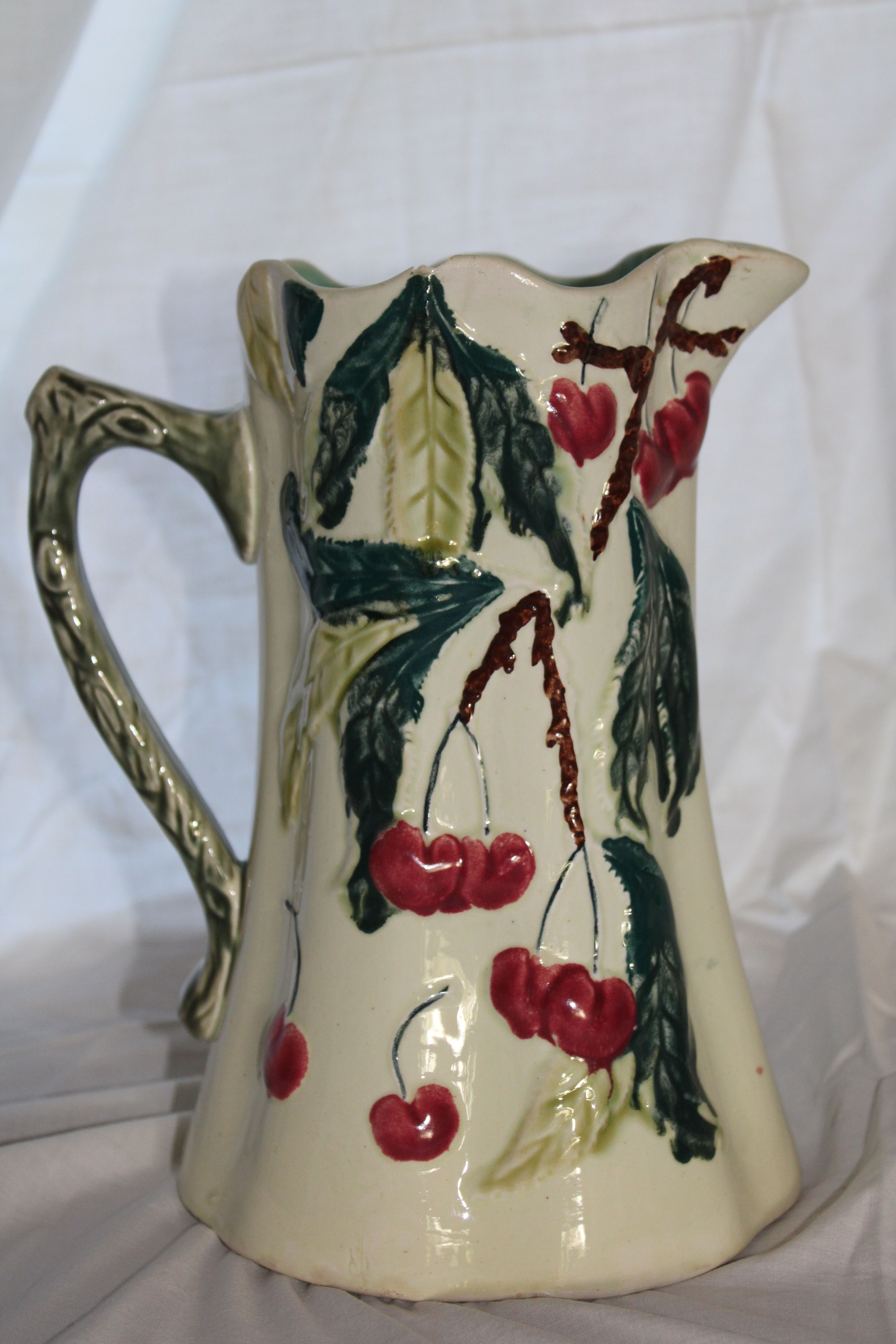 Ancient pitcher in earthenware decoration cherry Saint Amand waters