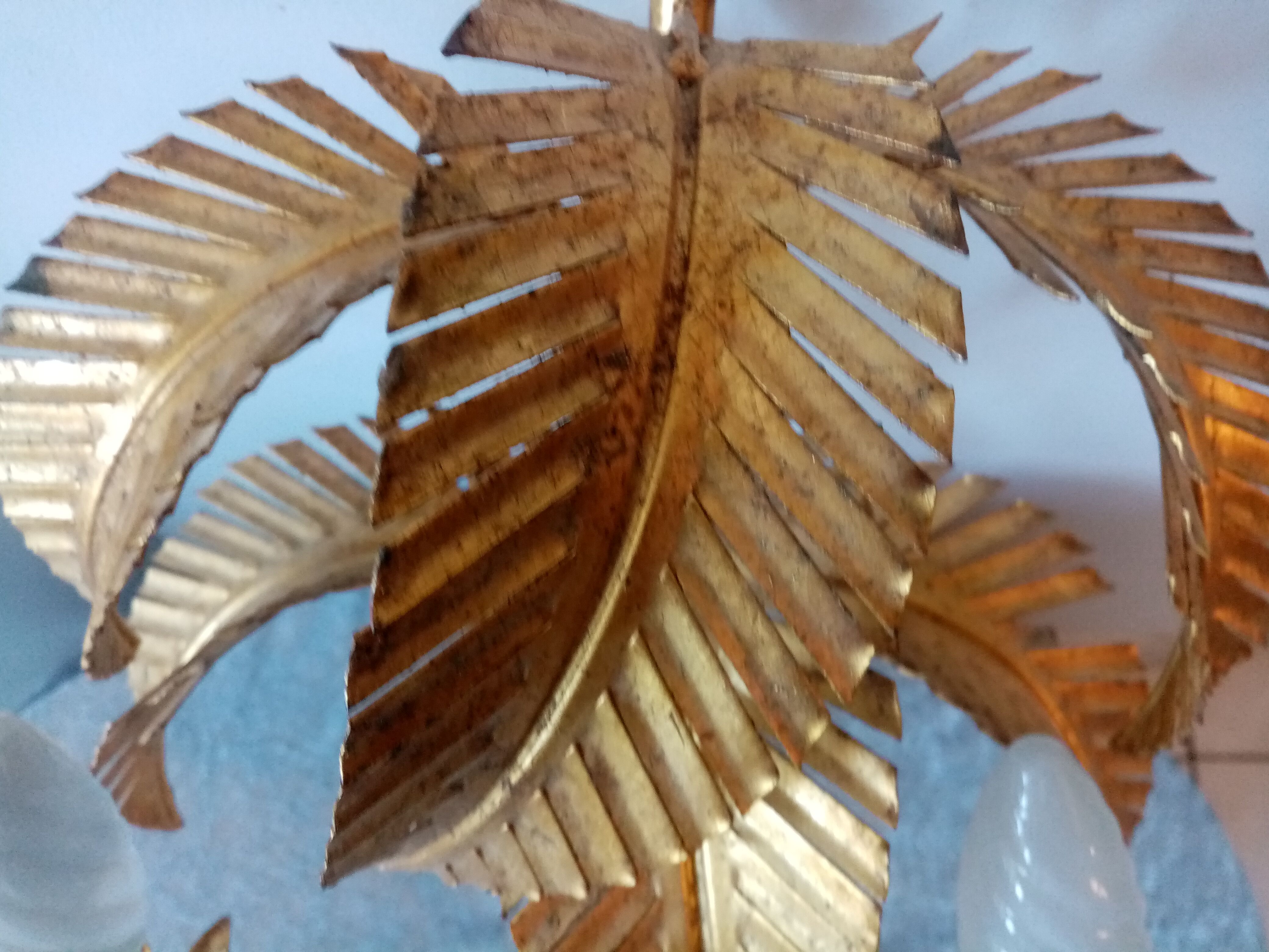 Old wall lamp palm shaped metal dore with leaf