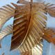 Old wall lamp palm shaped metal dore with leaf