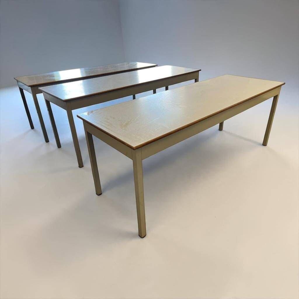 Vintage industrial table with a Formica top and wooden accents.
