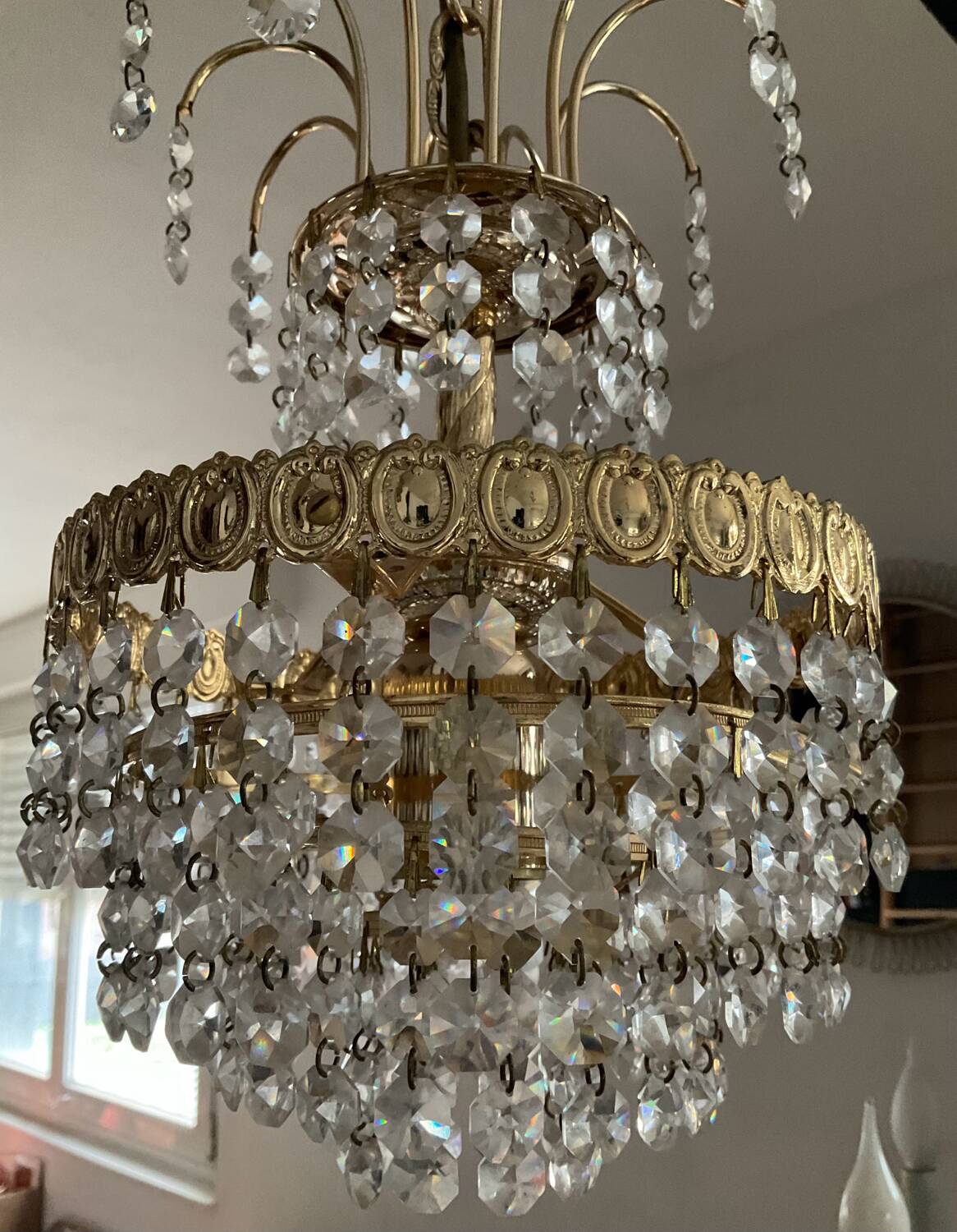 Cascade chandelier with crystal and brass tassels