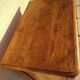 Furniture with a cherry wood door.