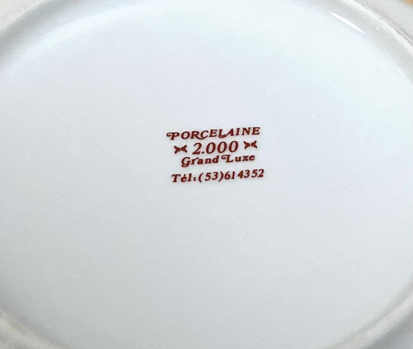 Vintage porcelain service: salad bowl and 8 small bowls.