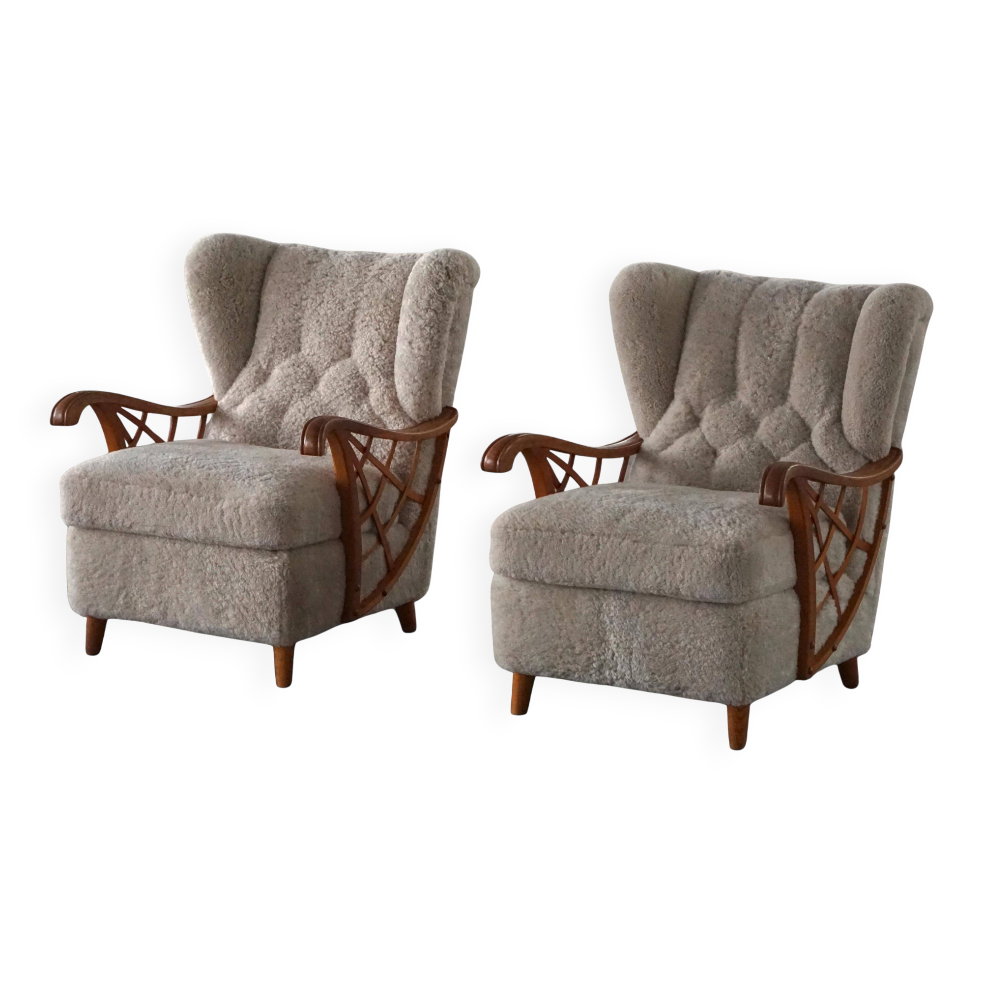 Pair of modern Swedish lounge chairs, shearling sheepskin and elm, 1940s.
