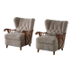 Pair of modern Swedish lounge chairs, shearling sheepskin and elm, 1940s.