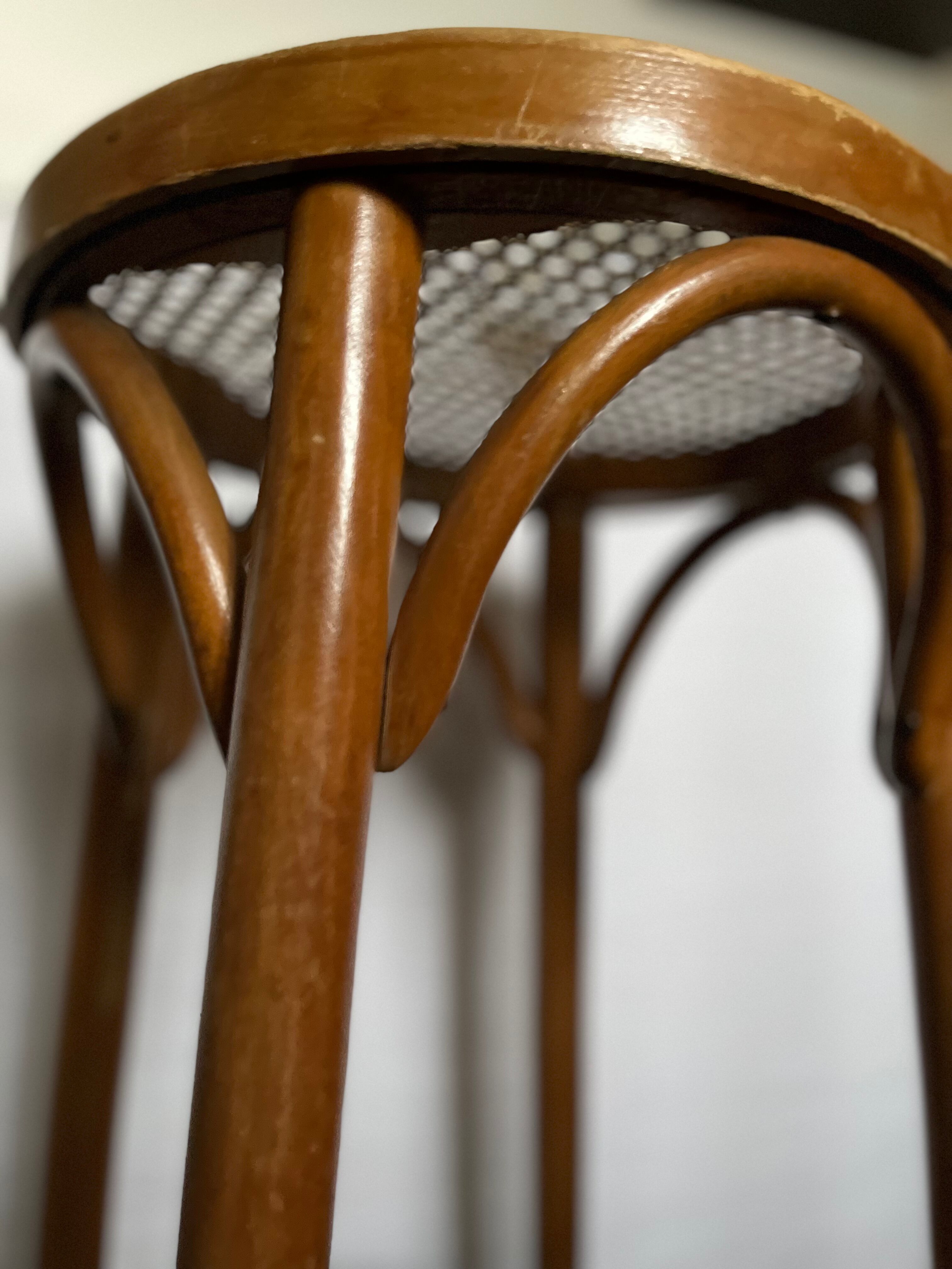 Curved wooden stool and cannage