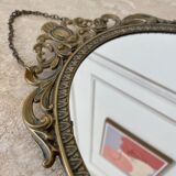 Miroir ovale en laiton doré