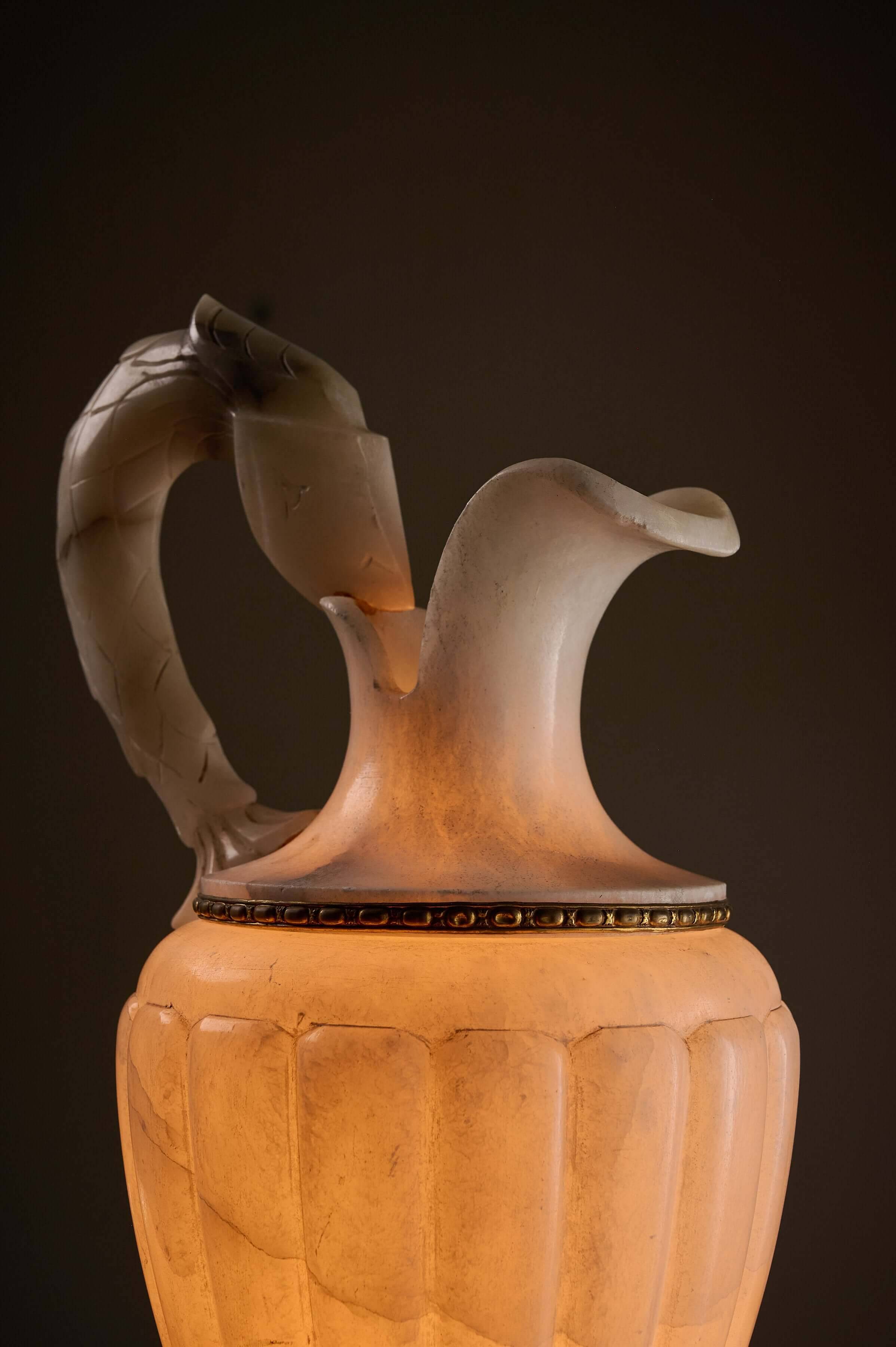 Carved alabaster urn lamp with stylized fish handle