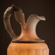 Carved alabaster urn lamp with stylized fish handle